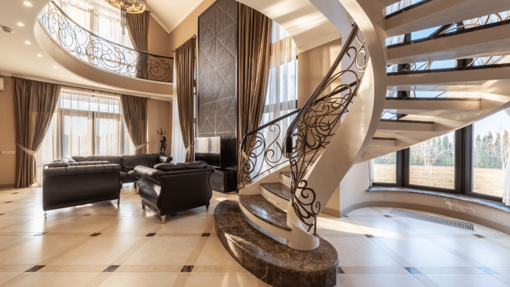 an elegant living room with a spiral staircase