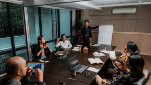 a group of people sitting around a conference table