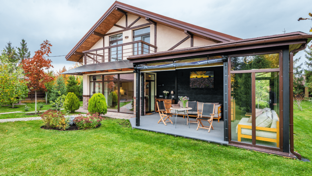 a backyard with a fire pit and patio furniture