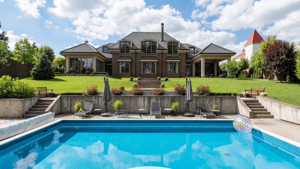 a large house with a pool in front of it