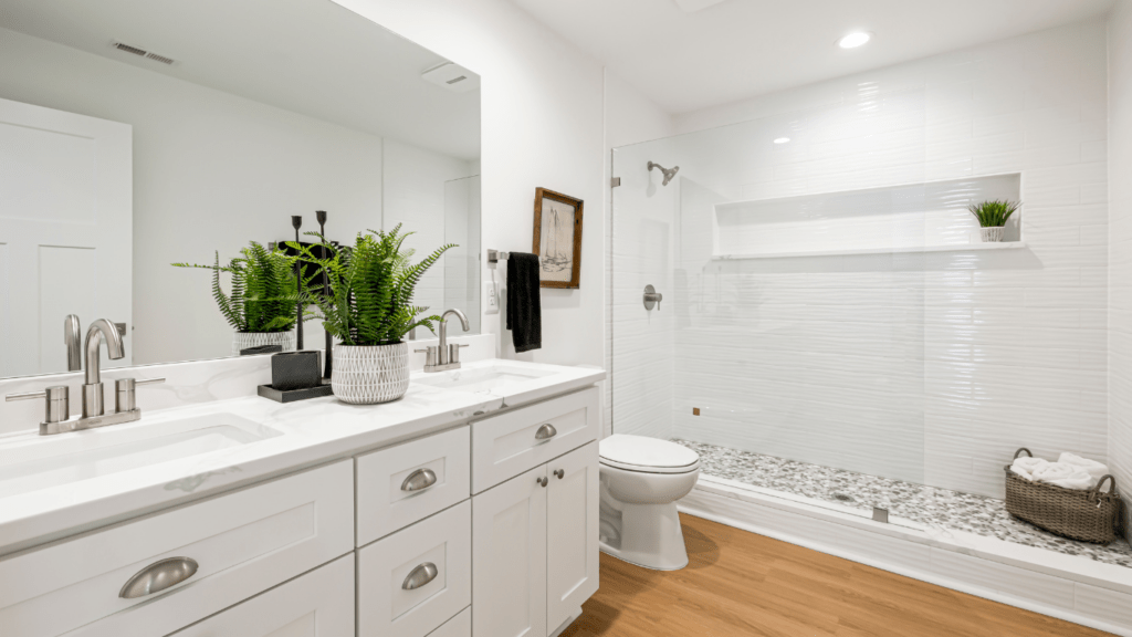 a modern bathroom with marble flooring and white fixtures