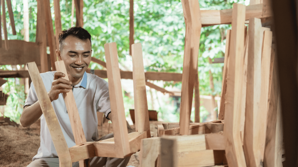 a person is working on a piece of wood with a saw