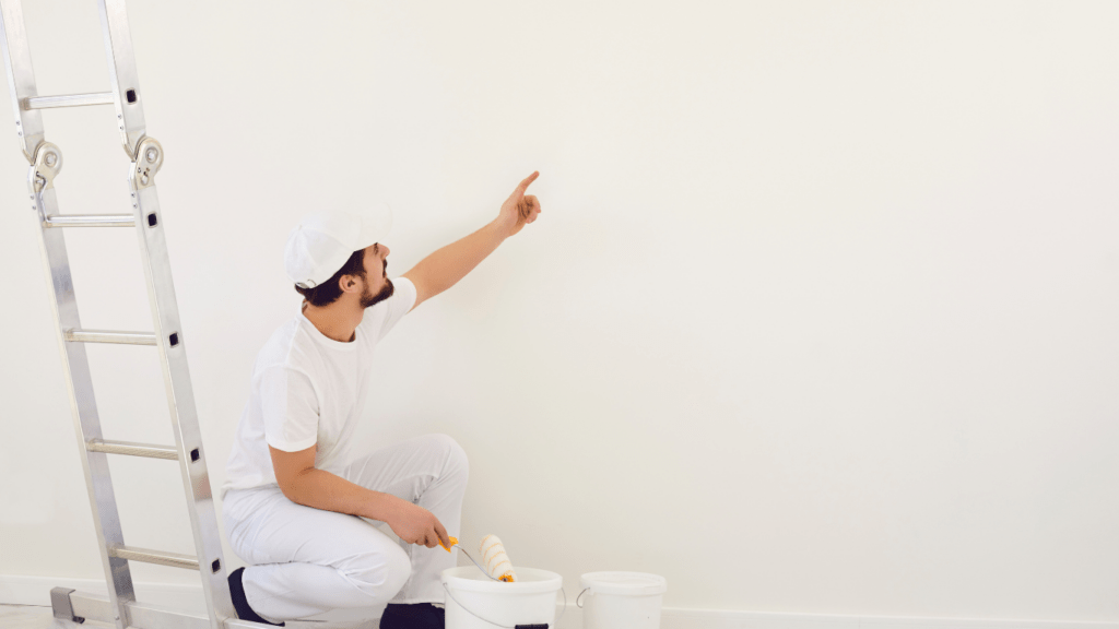 a person painting a wall