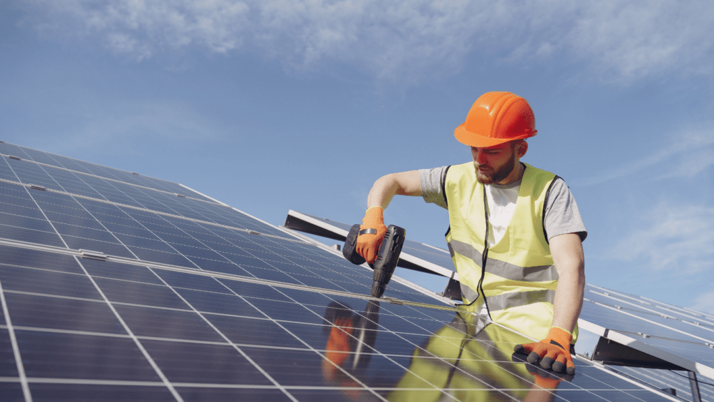 a person working on a solar panel