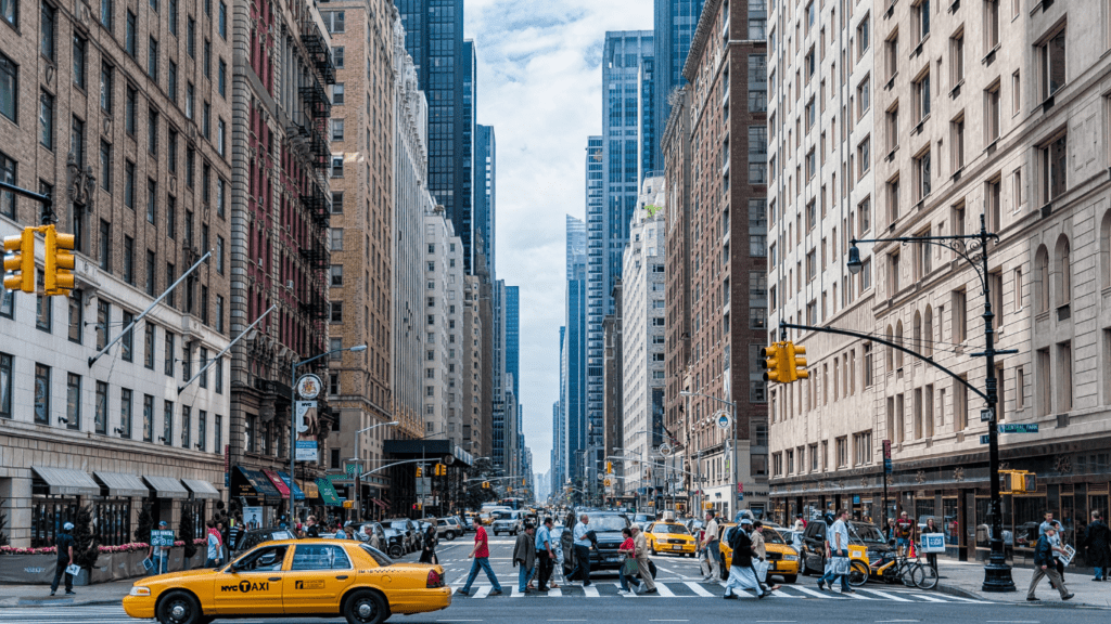 pedestrians cross the street in new york city