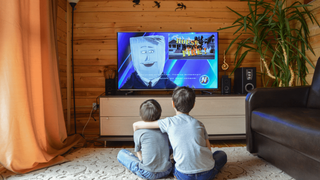 people sitting in front of a television watching Netflix